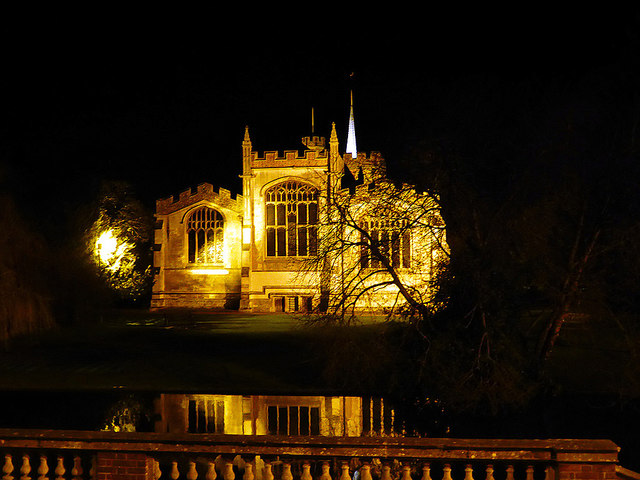 St Mary's Church, Hitchin, floodlit at night and reflected in the River Hiz